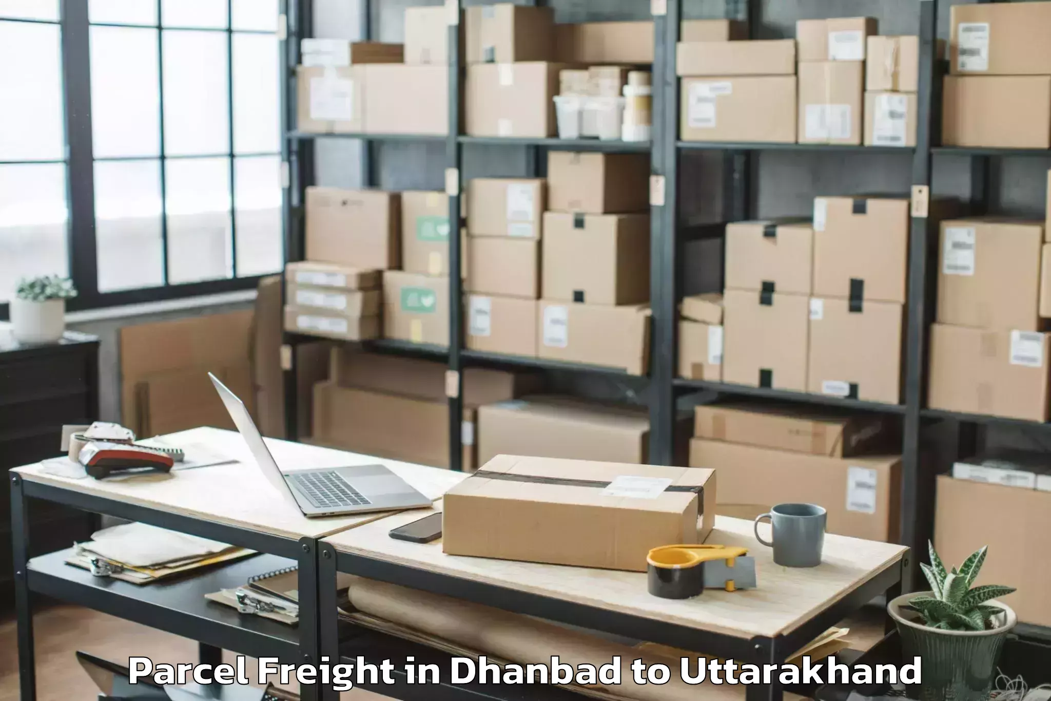 Dhanbad to Gadarpur Parcel Freight Booking